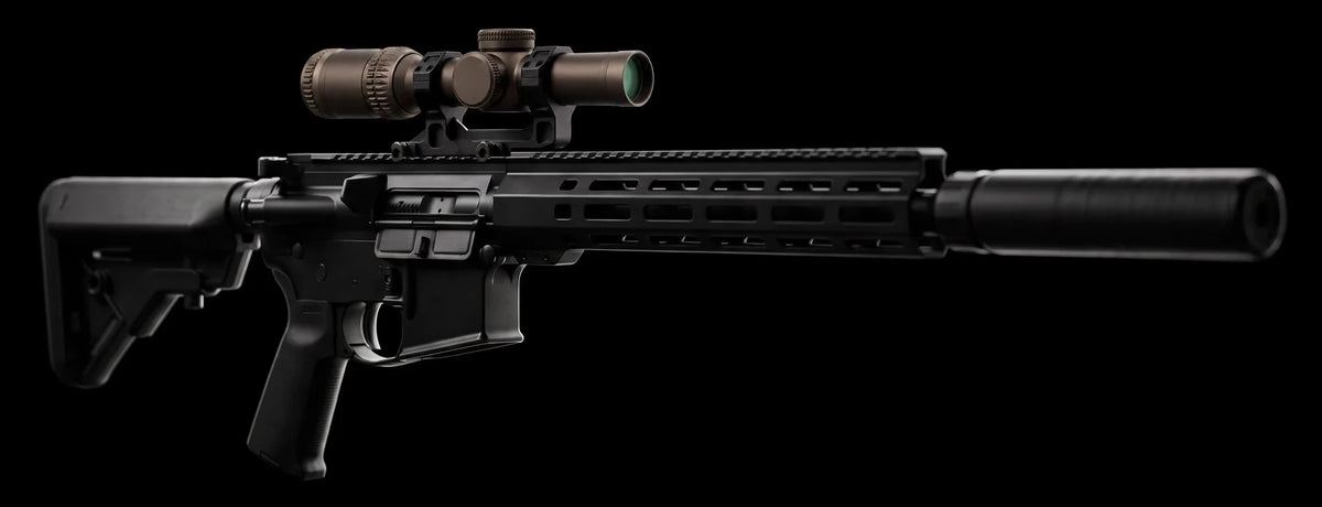 Night Operators RZ 1-6 in the black Geissele mount on the top rail of a suppressed black carbine, side view on black