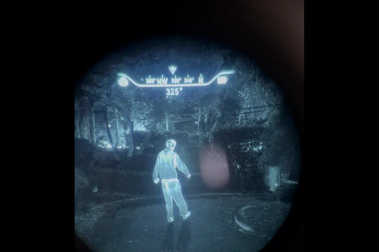 Real view through a PVS-14 with the Jerry-C Pro COTI clip-on thermal in highlight mode: a person glows, compass heading at the top