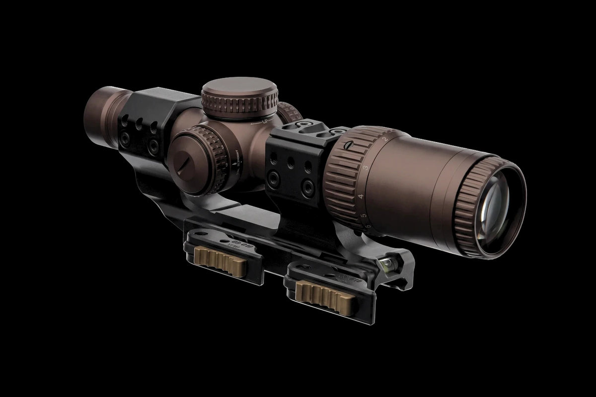 Night Operators RZ 1-6 in tan, clamped in the black Spuhr QDP quick detach cantilever 30 mm mount, on black